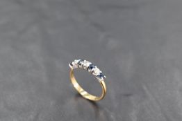 A seven stone sapphire and diamond half eternity ring, total approx 0.45ct on an 18ct gold loop,