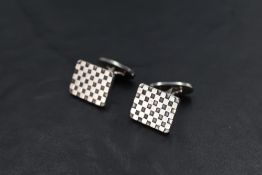 A pair of Georg Jensen silver cufflinks model: 113, having checker board patterned panels