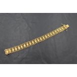 An 18ct gold multi-linked bracelet with lozenge decoration, marked 750, 17.5cm overall, 22grams