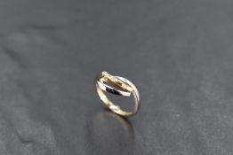 A 9ct white and yellow gold loop ring set with a trio of diamond chips, size K & approx 2.4g