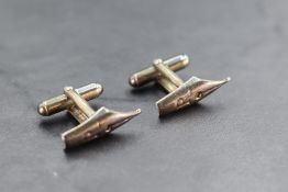 A pair of 925 grade white metal cuff-links, in the form of fountain pen nib form, marked 925 along
