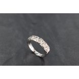 A six stone diamond half eternity ring, total approx 1.5ct in miligrain mount on an 18ct white