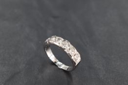 A six stone diamond half eternity ring, total approx 1.5ct in miligrain mount on an 18ct white