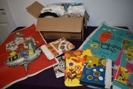 A selection of vintage table linen and tea towels, some bright patterns and designs to be included.