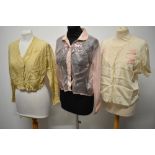 A trio of early 20th century blouses, to include, pink gossamer silk with long sleeves, patterned