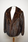 A 1950s brown mink short jacket having ' Maurice Velody, Sundlerland' label.