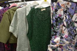 A mixed lot of vintage clothing, various styles and sizes, including metallic green 1960s tank top.