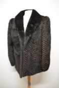 A 1970s dark brown/ black mink coat having chevron pattern interspersed with suede, Vintage size