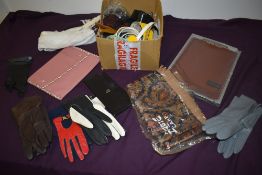 An assortment of vintage gloves, belts, scarves and accessories.