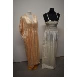 A 1950s white nightdress with shirred bodice and a 1930s/40s pink nightdress, for repair,