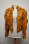 A 1970s/80s tan leather jacket, having stud and tassel details.