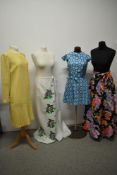 A collection of mixed vintage 1960s and 70s clothing, various styles and sizes, including bright