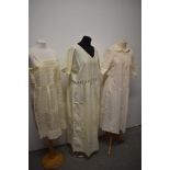 An assortment of antique underwear and nightwear, bed jacket, slip, corset cover, bloomers,