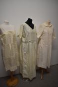 An assortment of antique underwear and nightwear, bed jacket, slip, corset cover, bloomers,