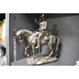 A 20th century Arnoux Paris cast bronze sculpture of a cowboy on horse back. 37cm tall.