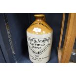 An early 20th century salt glazed advertising bottle for Temperance Herbal Beverages Heysham and