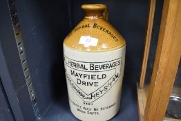 An early 20th century salt glazed advertising bottle for Temperance Herbal Beverages Heysham and