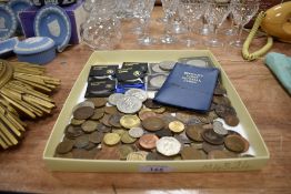 A selection of collectable coins and currency including cased coin sets.
