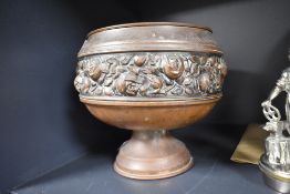 An antique copper planter having formed pressed flower design, 18cm tall.