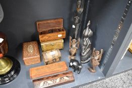 A selection of African and ethnic wooden carved figures and selection of incense and similar boxes.
