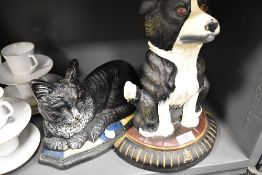 Two cast iron door stops including a Collie dog and a Tabby cat.