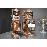 A pair of 20th century African totem figures carved in a hard Ethnic wood. 16cm tall