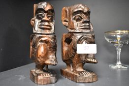 A pair of 20th century African totem figures carved in a hard Ethnic wood. 16cm tall