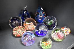A selection of modern art glass paper weights including millefiori, two by Caithness and a lamp