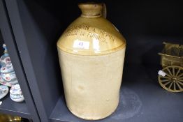 An early 20th century salt glazed advertising flagon for Thomson and Sons Barrow in Furness 31cm