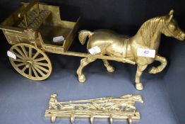 A vintage cast brass horse and cart figure with a similar key rack.