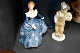 A Royal Doulton Fragrance figurine HN2334 boxed with a Nao figure of a boy holding a football