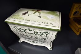 An early 20th century Royal Doulton Huntley and Palmers advertising container in the form of a