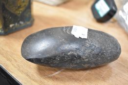 A Neolithic period stone carved axe head aprox 10cm long.
