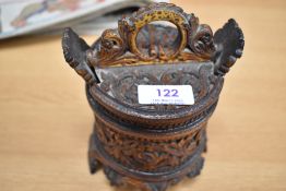 A hand carved wooden oriental container possibly from Bali or Indonesia