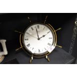 A mid century Metamec sailors ships wheel design clock.