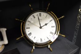 A mid century Metamec sailors ships wheel design clock.
