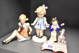 Three Goebel figurines having early bee stamps including Child and Poodle Reading, Girl Playing