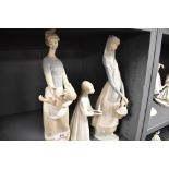 Three Lladro figure studies including Lady with backet, Girl in nightdress and Lady Holding nude