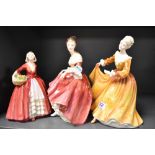 Three Royal Doulton figure studies including Southern Belle HN2229, Janet HN1537 and Kirsty HN2381