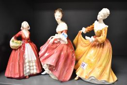 Three Royal Doulton figure studies including Southern Belle HN2229, Janet HN1537 and Kirsty HN2381