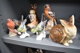 Eight animal figure studies including Royal Worcester Chaffinch, Goebel birds and two Poole
