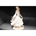 A Lladro figure study Cinderella AF having lost a finger and thumb.