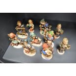 Ten Goebel Hummel small size figurines in vary poses and subjects.