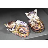 Two Royal Crown Derby Gold stopper paper weight figure studies of a Cat sleeping and a cat playing.