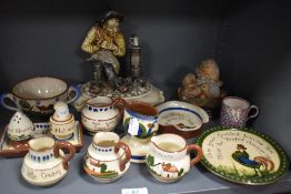 A selection of vintage Torquay motto ware, to include cruet, jugs, two handled mug etc.