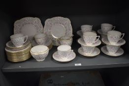 A collection of Mintons 'Petunia' cups and saucers, plates, jug and sugar basin.