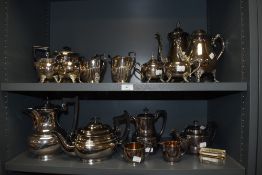 A large lot of vintage plated ware, to include; tea and coffee pots, jugs, sugar basins etc.