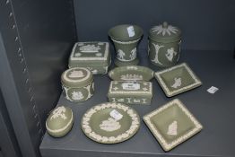 Ten pieces of Wedgwood, green jasper ware, sprigged in the traditional manner.