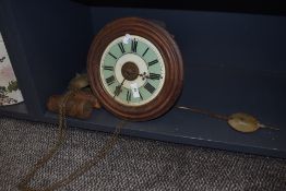 A 19th century continental wall clock, having under painted glass face, with weights and pendulum.