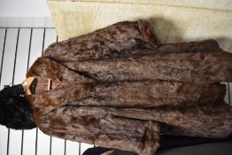 A vintage squirrel fur coat, and a fur hat, medium to large size.